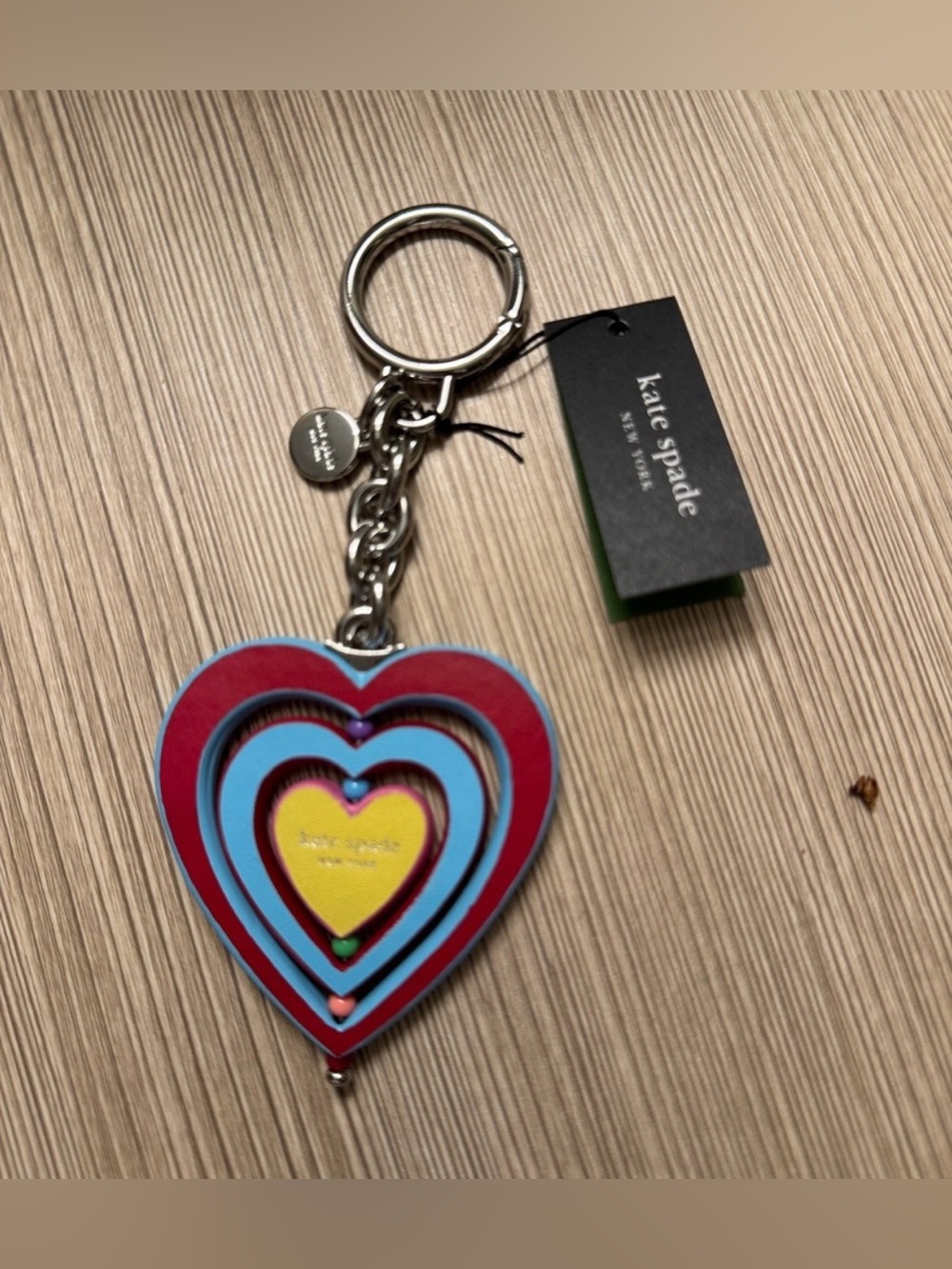 Kate Spade New York vibrant, multi-layered heart bag charm/key fob